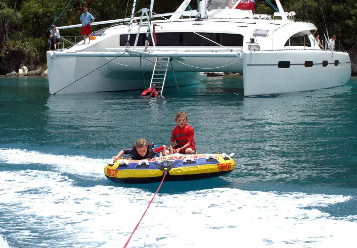 Guests on Zingara tubing during their BVI Sailing Vacation