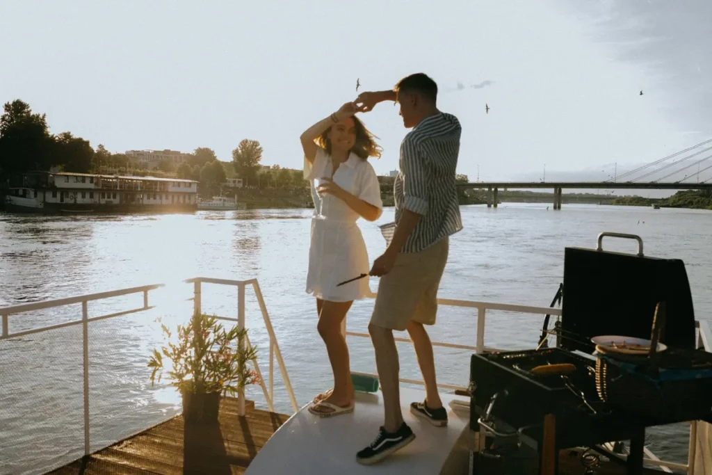 A couple celebrating honeymoon on a sailing catamaran charter